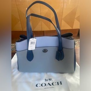 Beautiful Coach purse 15 l, 7 w, 10.5 h. Brand new. Zip close.